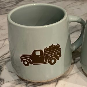 Large green mug that holds 16oz ☕️ Terra Cotta‎ bottom and a pic of a truck 🛻